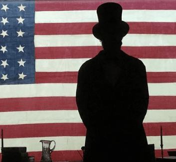 Silloutte of president Lincoln against the American Flag